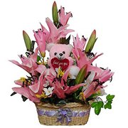 Bright Artificial Flowers with Teddy in a Basket...