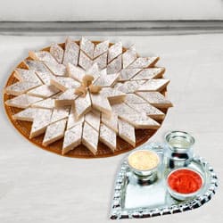 Silver Plated Paan Shaped Puja Aarti Thali (weight 52 gms) with Haldiram Kaju Katli to Darjiling Silver Plated Paan Shaped Puja Aarti Thali (weight 52 gms) with Haldiram Kaju Katli to Darjiling