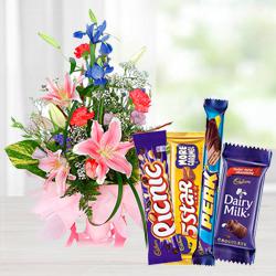 Charming seasonal Flowers with mouth-watering mixed Cadburys Chocolate to Garia Charming seasonal Flowers with mouth-watering mixed Cadburys Chocolate to Garia