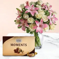 Marvelous Lilies n Roses in Glass Vase with Ferrero Rocher Moments to Cooch behar