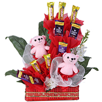 Tempting Arrangement of Teddies along with Cadbury Chocolates in a Basket Tempting Arrangement of Teddies along with Cadbury Chocolates in a Basket