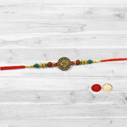 Resplendent Rakhi with a Swastik at the Center Resplendent Rakhi with a Swastik at the Center