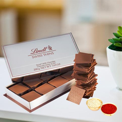 Lindt Swiss Thins with free Roli Tilak and Chawal. Lindt Swiss Thins with free Roli Tilak and Chawal.