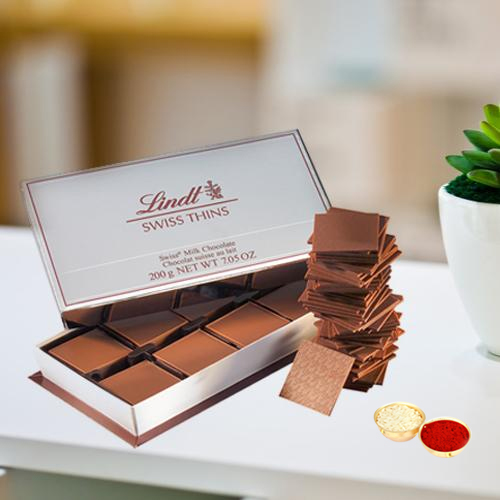 Lindt Swiss Thins with free Roli Tilak and Chawal. Lindt Swiss Thins with free Roli Tilak and Chawal.