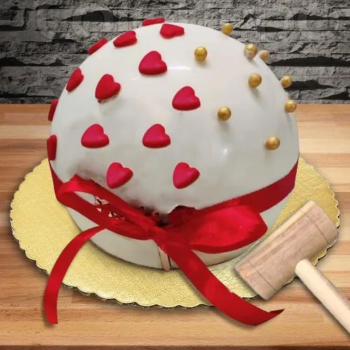 Delectable Round Piata Cake with Hammer