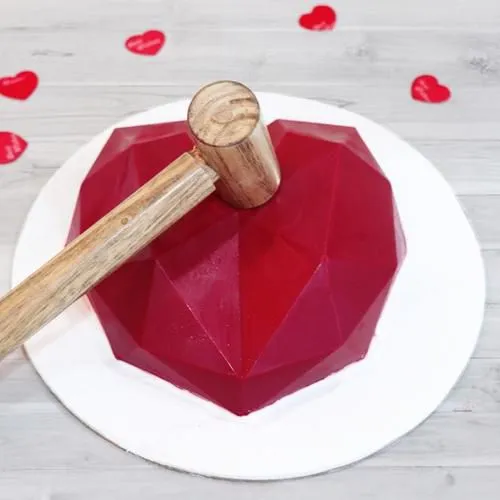 Delicious Red Heart Shape Piñata Cake with Hammer