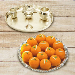 Silver plated Puja Thali with Silver Plated Lakshmi Ganesha with Haldiram’s Pure Ghee Ladoo Silver plated Puja Thali with Silver Plated Lakshmi Ganesha with Haldiram’s Pure Ghee Ladoo