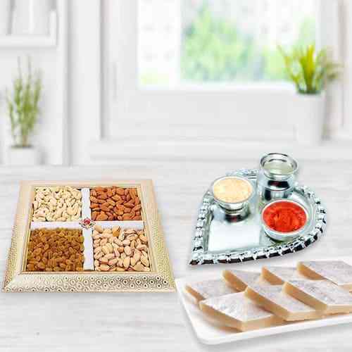 Silver Plated Paan Shaped Puja Aarti Thali (weight 52 gms) with Assorted Dry fruits with Haldiram Kaju Katli Silver Plated Paan Shaped Puja Aarti Thali (weight 52 gms) with Assorted Dry fruits with Haldiram Kaju Katli