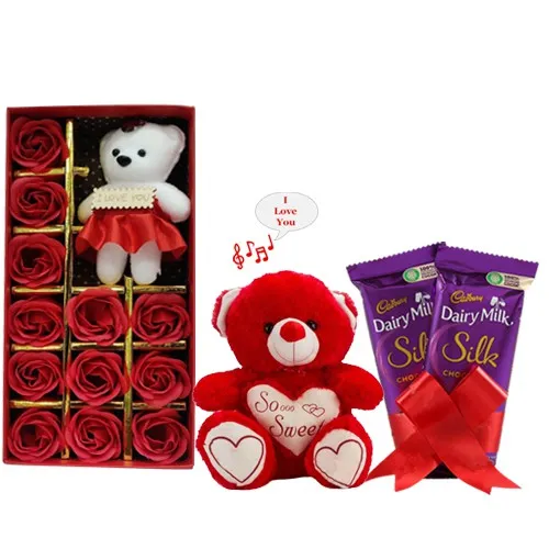 Spectacular Teddy on Artificial Red Roses with Chocolate N Singing Soft Toy Combo Spectacular Teddy on Artificial Red Roses with Chocolate N Singing Soft Toy Combo