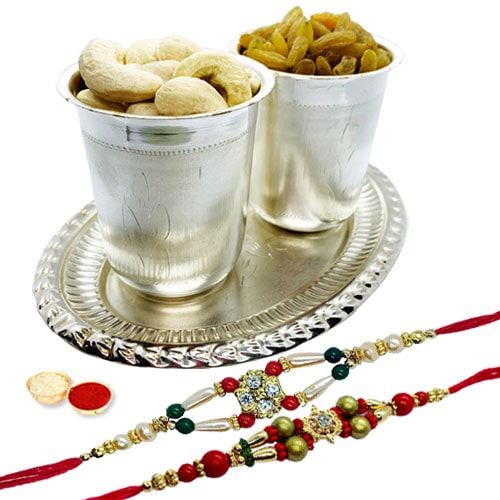 Special dry fruit hamper in Silver plated Glass and tray with 2 free Rakhi, Roli tilak and Chawal Special dry fruit hamper in Silver plated Glass and tray with 2 free Rakhi, Roli tilak and Chawal