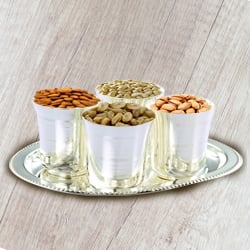 Crunchy mixed Dry Fruits with Silver Glasses and Tray Crunchy mixed Dry Fruits with Silver Glasses and Tray