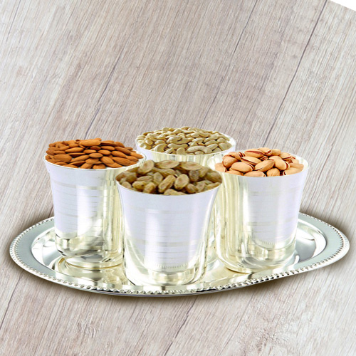 Crunchy mixed Dry Fruits with Silver Glasses and Tray Crunchy mixed Dry Fruits with Silver Glasses and Tray
