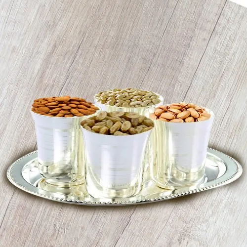 Crunchy mixed Dry Fruits with Silver  Glasses and Tray