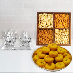 Delicious Dry Fruits and Sweets with Silver Plated Ganesh Lakshmi Delicious Dry Fruits and Sweets with Silver Plated Ganesh Lakshmi