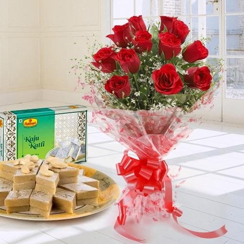 Lovely charming Red Roses combined with mouthwatering Kaju Katli Lovely charming Red Roses combined with mouthwatering Kaju Katli