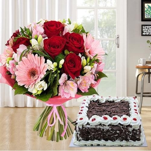 Mixed fresh Seasonal Flowers with festive Black Forest Cake Mixed fresh Seasonal Flowers with festive Black Forest Cake