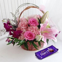 Appealing Box of Cadburys Chocolate with Flower Arrangement Appealing Box of Cadburys Chocolate with Flower Arrangement