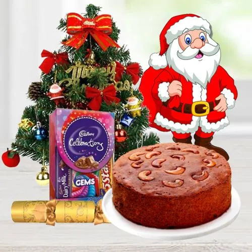 Christmas Fruit Cake 1 Lbs. with Christmas Tree 1 Ft. long artificial, Assorted Cadburys Chocolates for hanging ( 130 G.), Star and Bells for decoration, Santa Claus and  Handheld Ribbon Crackers for Christmas