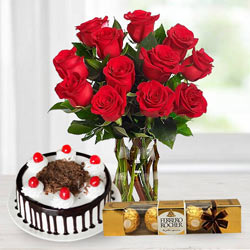 Gorgeous Bouquet of bright Red Roses, tasty Ferroro Rocher and delicious Black Forest Cake Gorgeous Bouquet of bright Red Roses, tasty Ferroro Rocher and delicious Black Forest Cake