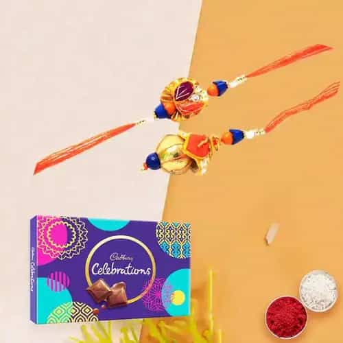 Lovely Rakhi celebration pack with Bhaiya Bhabhi Rakhi, free Roli tika and Chawal Lovely Rakhi celebration pack with Bhaiya Bhabhi Rakhi, free Roli tika and Chawal