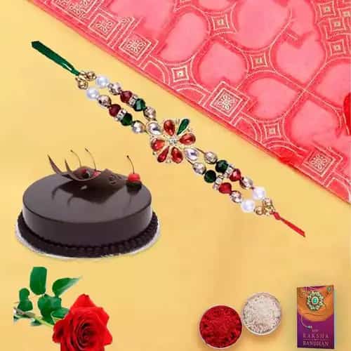Yummy chocolaty cake and rose with free Rakhi roli tilak and Chawal Yummy chocolaty cake and rose with free Rakhi roli tilak and Chawal
