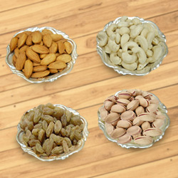 Delectable mixed Dry Fruits with Silver plated bowls Delectable mixed Dry Fruits with Silver plated bowls
