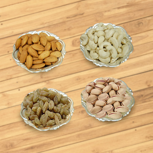 Delectable mixed Dry Fruits with Silver plated bowls Delectable mixed Dry Fruits with Silver plated bowls