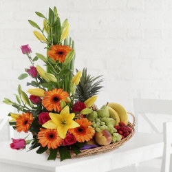 A beautifully arranged fruit and flower basket for dear mom A beautifully arranged fruit and flower basket for dear mom