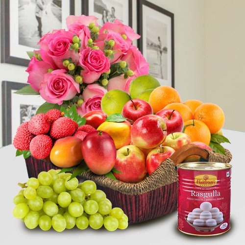Fresh Fruits and Haldiram Rasgulla for Mummy with Pink Rose Bouquet. Fresh Fruits and Haldiram Rasgulla for Mummy with Pink Rose Bouquet.