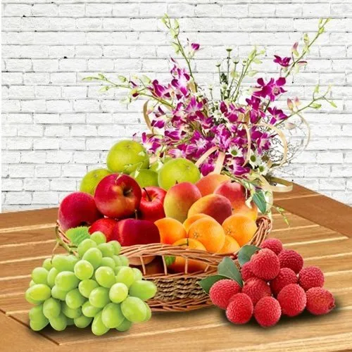 Juicy Fresh Fruits in a Orchid decorated Basket for Mummy