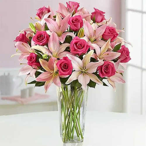 Designer Display of Roses N Lilies in Glass Vase	