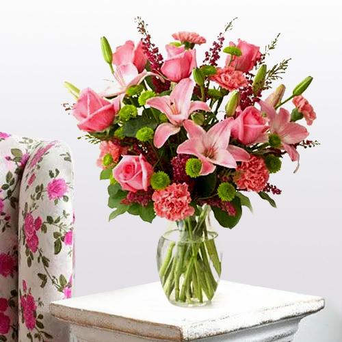 Heavenly Arrangement of Lilies, Roses and Carnations with a Circus of Celebration Heavenly Arrangement of Lilies, Roses and Carnations with a Circus of Celebration