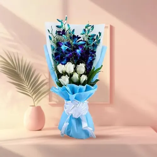 Impressive Bouquet of Blue Orchids N White Roses in Tissue Wrap