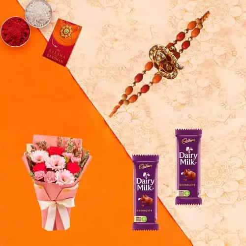 Rhapsodic Blossom Olio with 2 Dairy Milk Chocolate with Rakhi and Roli Tilak Chawal Rhapsodic Blossom Olio with 2 Dairy Milk Chocolate with Rakhi and Roli Tilak Chawal