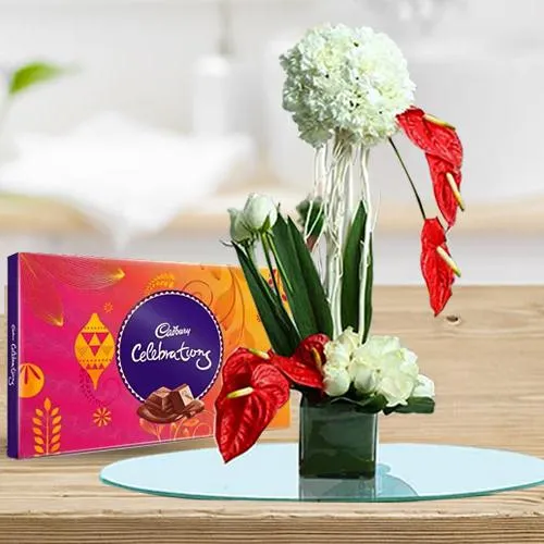 Ravishing Arrangement of Flowers in Glass Vase with Cadbury Celebration	