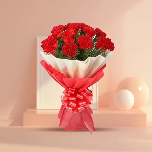 Now deliver this delicate Hand Bunch of Red Carnations in tissue Now deliver this delicate Hand Bunch of Red Carnations in tissue