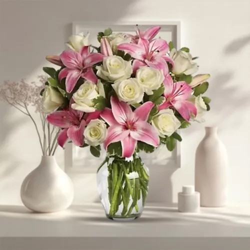 Striking Glass Vase display of White Roses N Pink Lilies
Striking Glass Vase display of White Roses N Pink Lilies