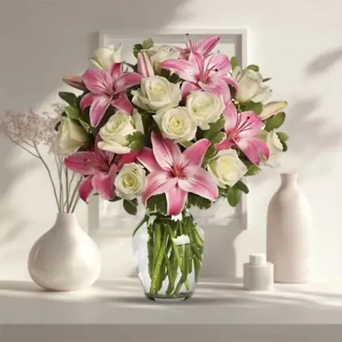 Striking Glass Vase display of White Roses N Pink Lilies
