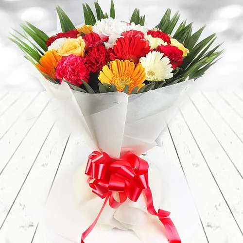 Color-Coordinated Hand Bunch of Gerberas and Carnations along with Roses
