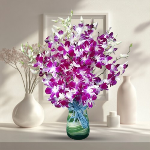 Eye-Catching Arrangement of Orchids in a Glass Vase Eye-Catching Arrangement of Orchids in a Glass Vase