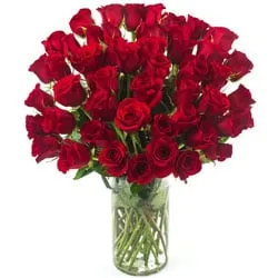 Attractive Arrangement of Red Color Roses in a Glass Vase
