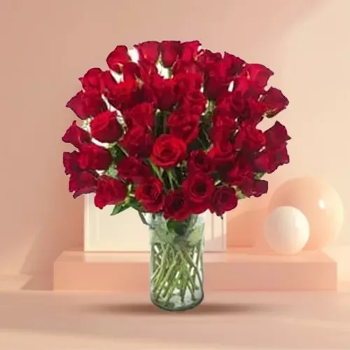 Attractive Arrangement of Red Color Roses in a Glass Vase
