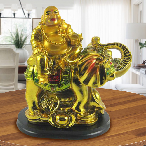 Laughing budha sitting on elephant Laughing budha sitting on elephant
