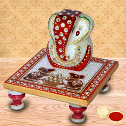 Delicately carved marbel designer ganesh with chowki with free Roli Tilak and Chawal Delicately carved marbel designer ganesh with chowki with free Roli Tilak and Chawal