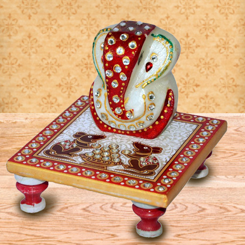Delicately carved marbel designer ganesh with chowki Delicately carved marbel designer ganesh with chowki