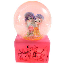 Romantic Love Couple with Floating Tinsel in a LED Lighted Glass Globe Romantic Love Couple with Floating Tinsel in a LED Lighted Glass Globe