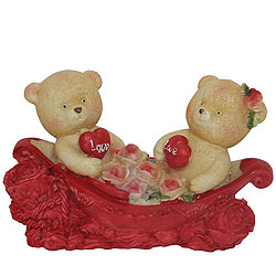 Cheerful Couple Teddy With Two Hearts and Roses in a Boat Cheerful Couple Teddy With Two Hearts and Roses in a Boat