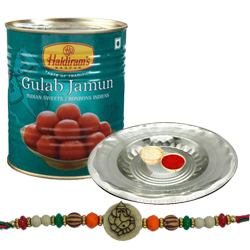 Appealing Ganesh Rakhi With Silver Puja Thali And Gulab Jamun Appealing Ganesh Rakhi With Silver Puja Thali And Gulab Jamun