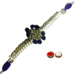 Scintillating 1 Blue And White Stone Rakhi in Round Shape Scintillating 1 Blue And White Stone Rakhi in Round Shape