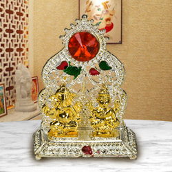 Silver Plated mandap with Golden Ganesh Laxmi Idol Silver Plated mandap with Golden Ganesh Laxmi Idol